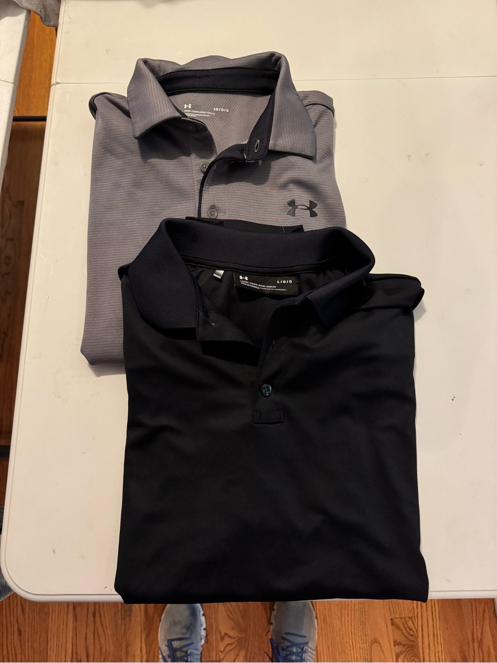Pair of Under Armour golf polos. Men’s size large. Like new no flaws